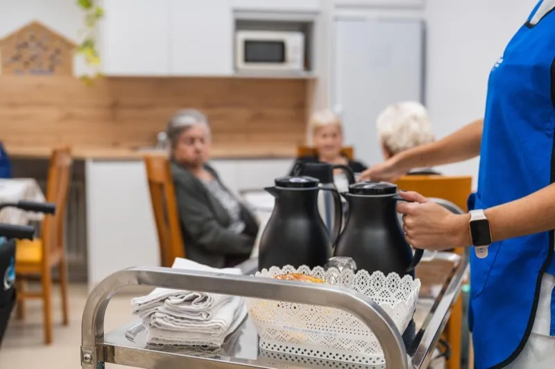 Caregiver providing compassionate care in a skilled nursing facility